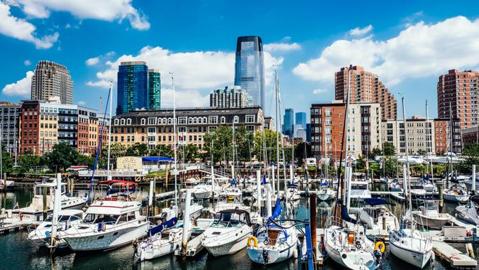 Large group of sailing yachts at the Manhattan Yacht Club marina, off Morris Canal Basin, at Marin Boulevard, Jersey City, New York State, USA.