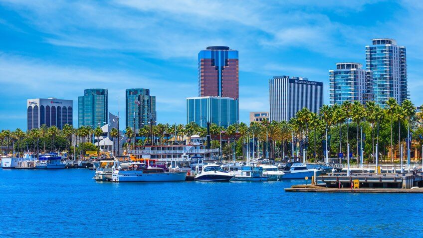 Rainbow Harbor at Long Beach Marina with city skyline, California.