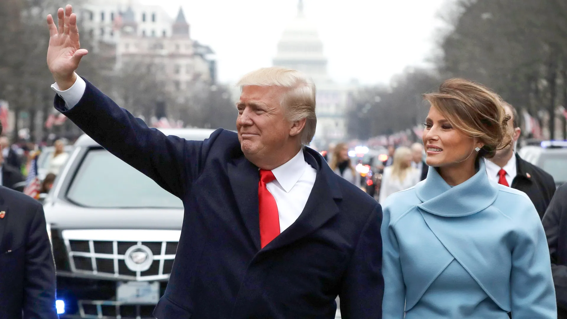 President Donald Trump waves with Melania Trump