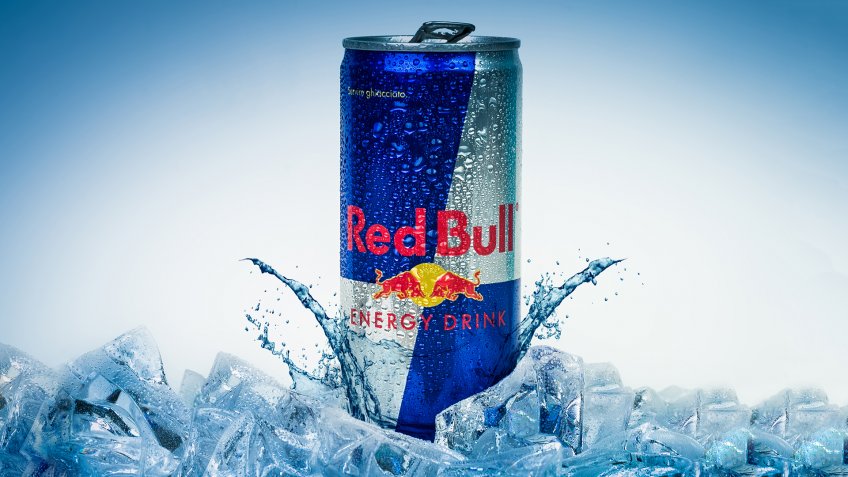 Trieste, Italy - May 29, 2016: Aluminium can of Red Bull Energy drink iced Background.