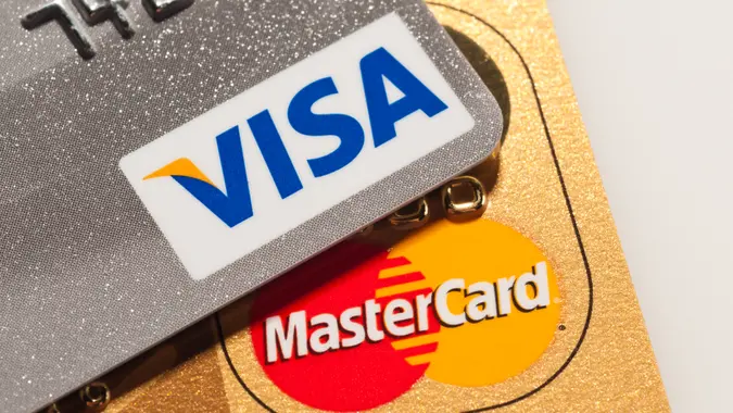 Caracas, Venezuela - July 22, 2011: Visa and Mastercard logos on platinum and golden credit cards.