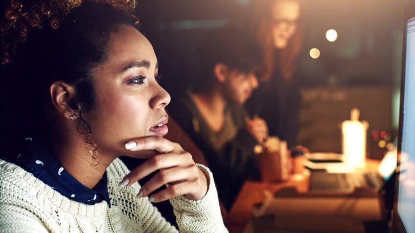 Shot of a young businesswoman working late in her office.