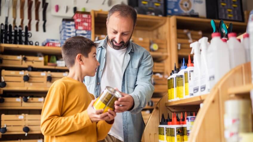 Photo of father and son in hardware store.