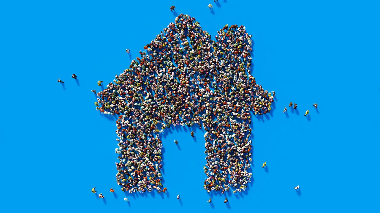 Human crowd forming a big house on blue background.