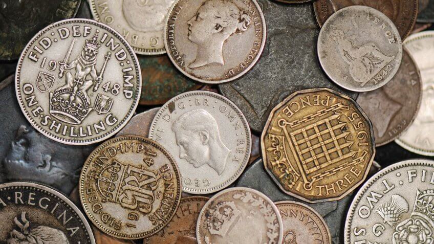 Pile of obsolete British coinage.