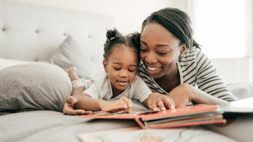 Mom reading for her daughter.