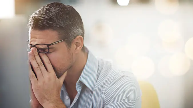 Cropped shot of a stressed businessman sitting at his deskhttp://195.