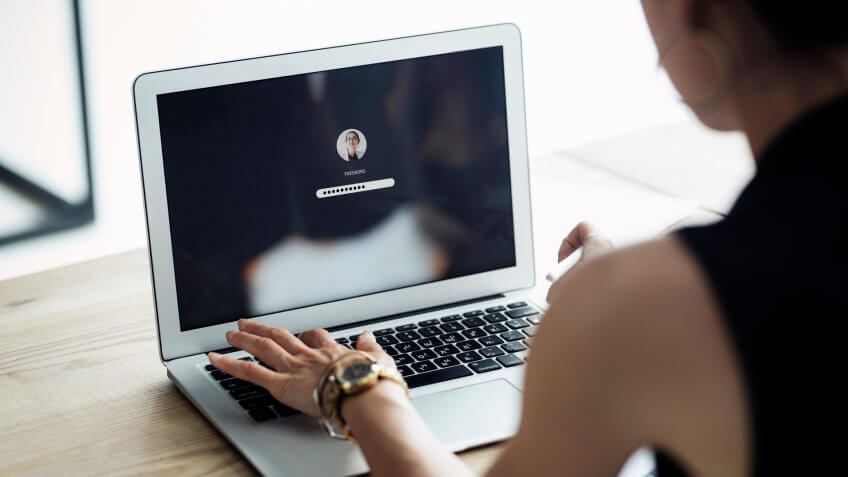 woman signing into her computer