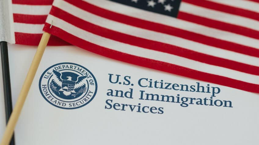 US flag and citizenship and immigration paperwork.