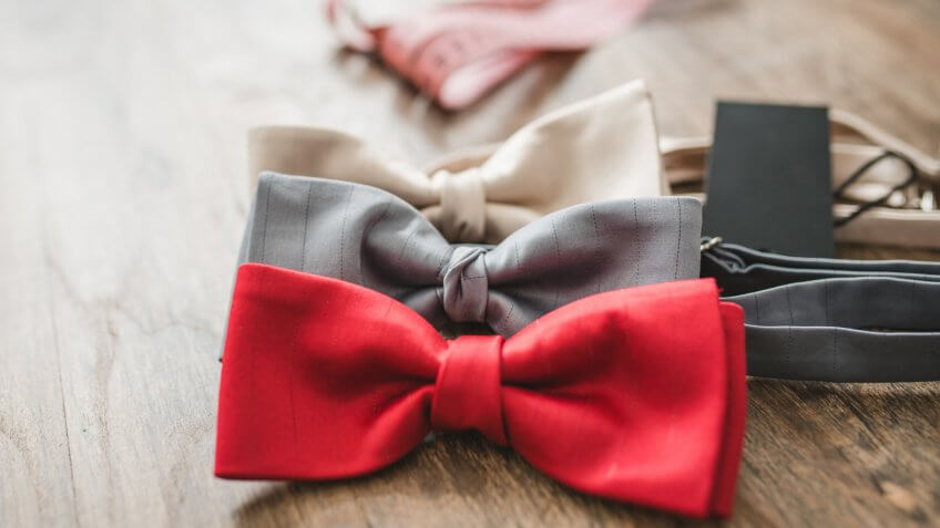 Bow ties on table in tailor shop.
