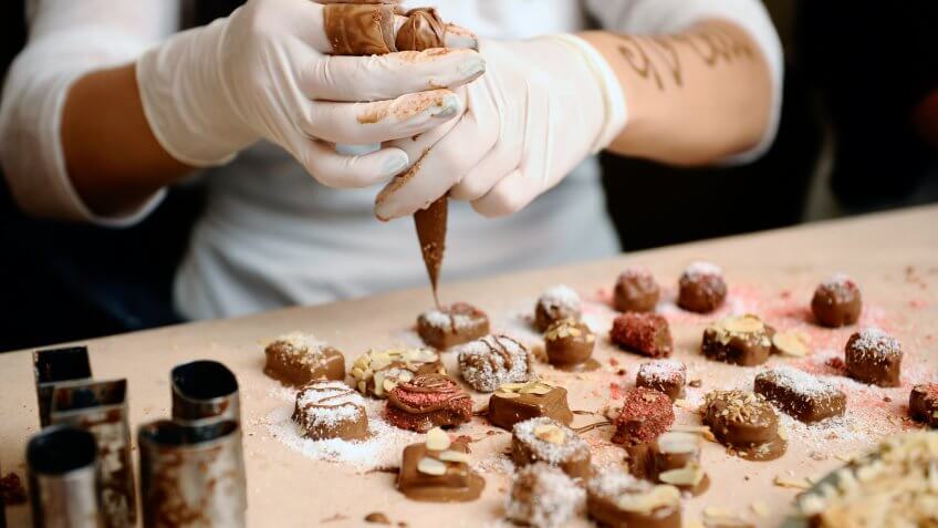 Confectioner decorated chocolates.