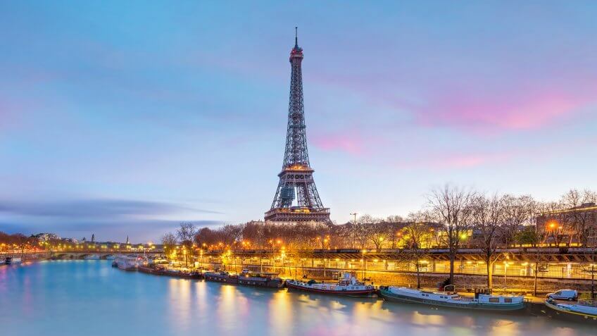 The Eiffel Tower and river Seine at twilight in Paris, France.