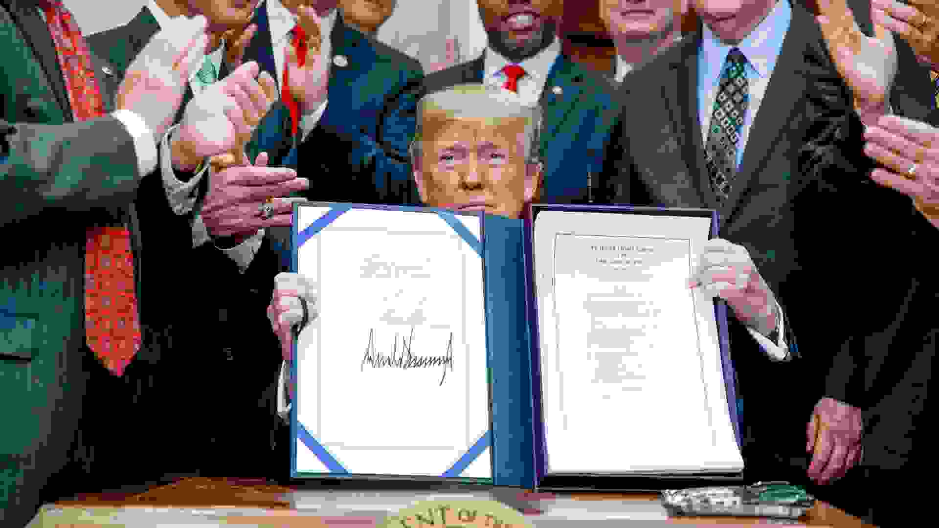 President Donald Trump signs the Economic Growth Regulation Relief and Consumer Protection Act