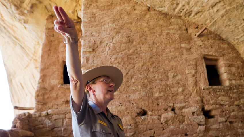National Park ranger pointing figures in direction