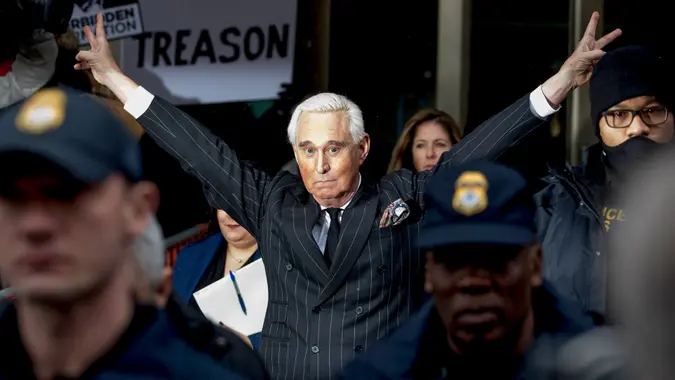 Roger Stone leaves federal court giving peace sign to crowd