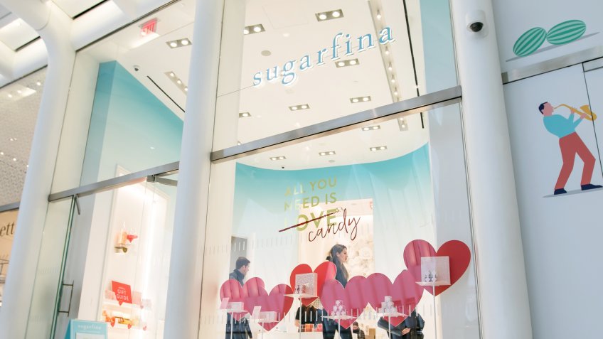 New York, Feb 9, 2018: Young man and woman are seen browsing a Sugarfina store.