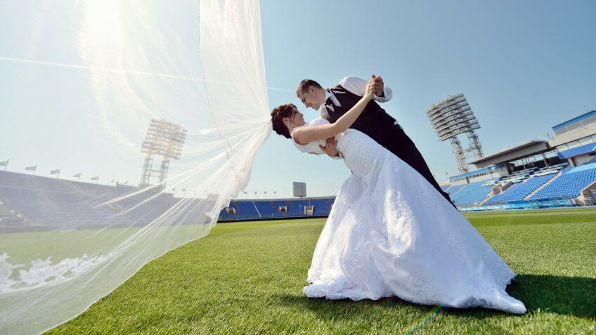 Wedding couple at a football stadium