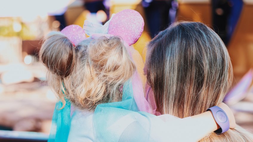 Young child with princess Minnie mouse ears