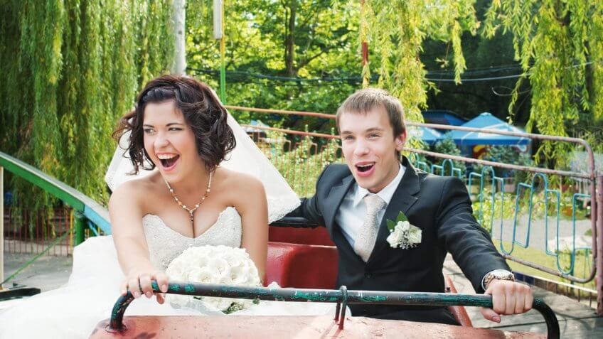 bride and groom on rollercoaster