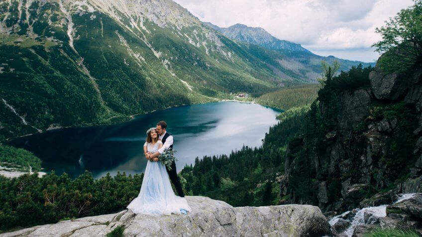 bride and groom wedding with a mountain view