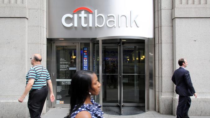 NEW YORK CITY - JULY 11: Pedestrians walk past a Citibank retail branch in lower Manhattan on Thursday, July 11, 2013.