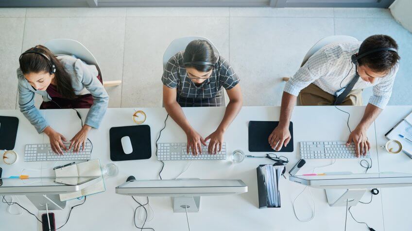 High angle shot of a team of call center agents working in an office.