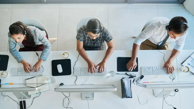 High angle shot of a team of call center agents working in an office.
