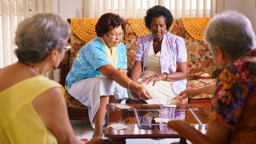 group of elderly women playing cards