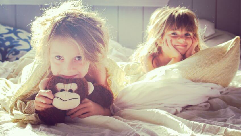 Two little girls in the early morning light.