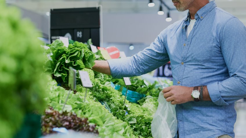 Shot of a handsome mature man shopping for healthy food in a grocery store.