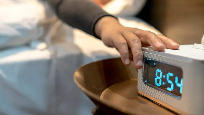 alarm clock at bedside.