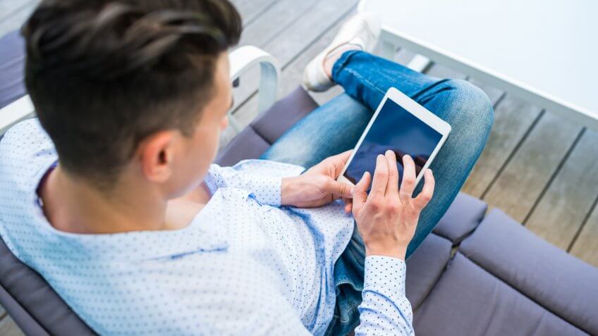 Relaxing on the porch with tablet.
