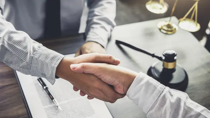 Handshake after good cooperation, Businessman handshake male lawyer after discussing good deal of Trading contract and new projects for the company of real estate, Meeting and greeting concept.
