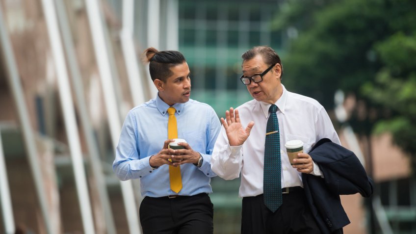 Senior businessman mentoring a colleague.