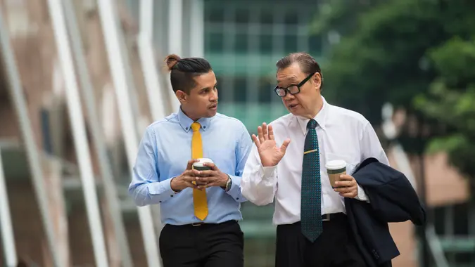 Senior businessman mentoring a colleague.