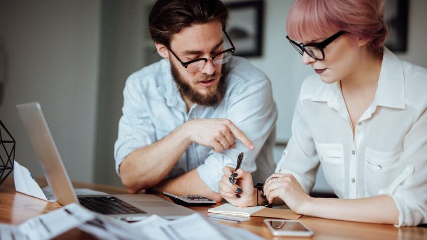 millennial couple figuring out finances