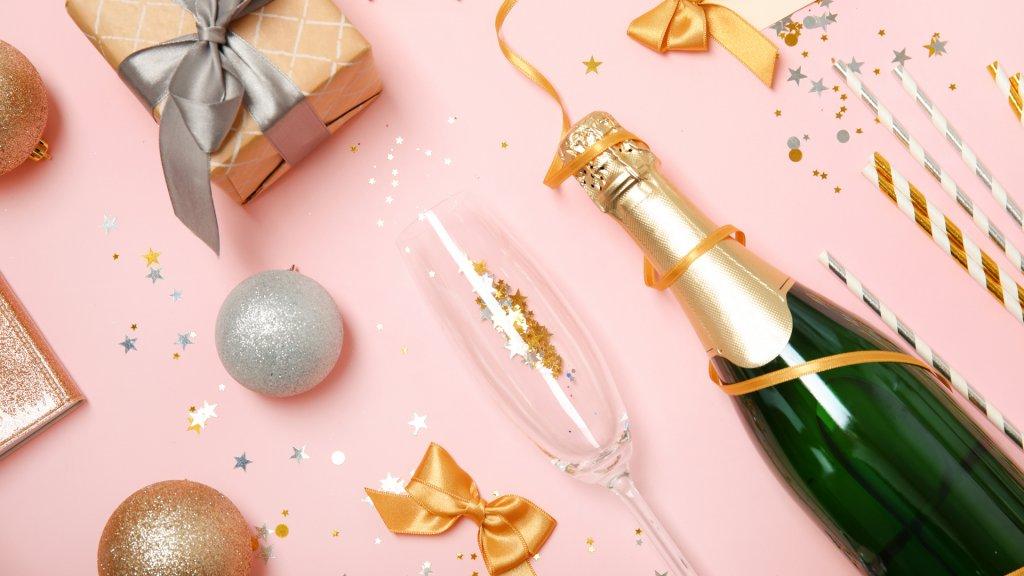 Creative flat lay composition with bottle of champagne and party accessories on color background - Image.