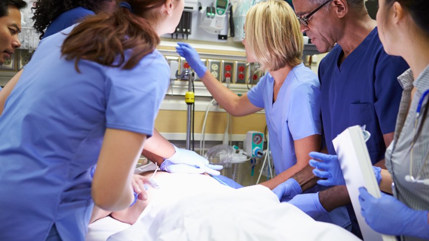 nurses and docors helping person in emergency room