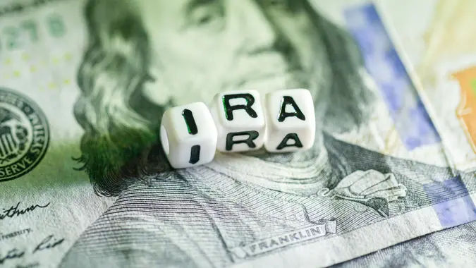 IRA cubic letter on 100 dollar at low light.