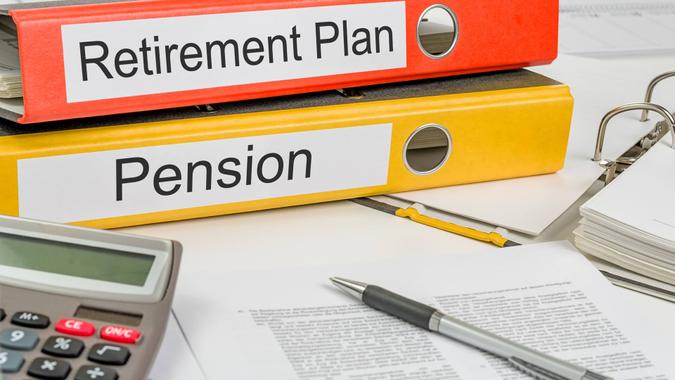 retirement plan and pension plan folders on desk
