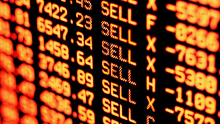 Trading screen financial data in red.