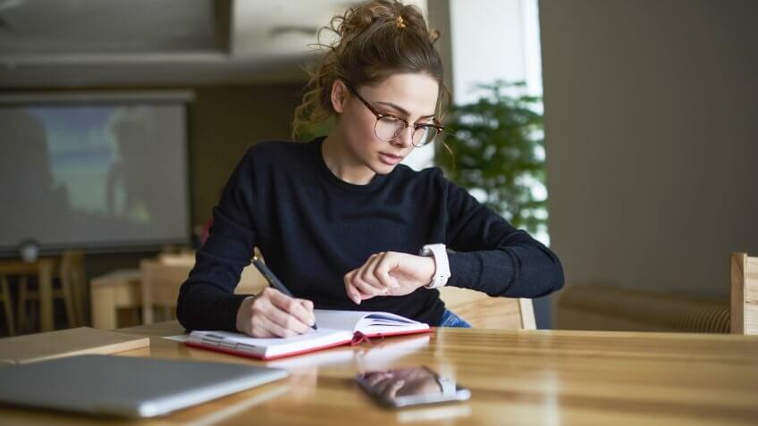 woman checking her watch for the time
