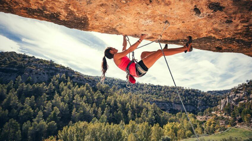 Woman rock climbing in Margalef Catalonia Spain.