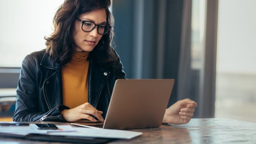 Asian woman working laptop.