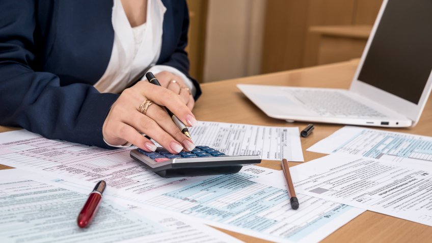 Woman filling US tax form.