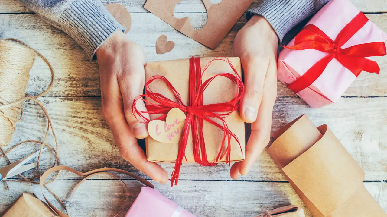 https://cdn.gobankingrates.com/wp-content/uploads/2019/02/wrapping-up-a-Valentines-Day-gift-iStock-1046102104.jpg?webp=1&w=1280&quality=75