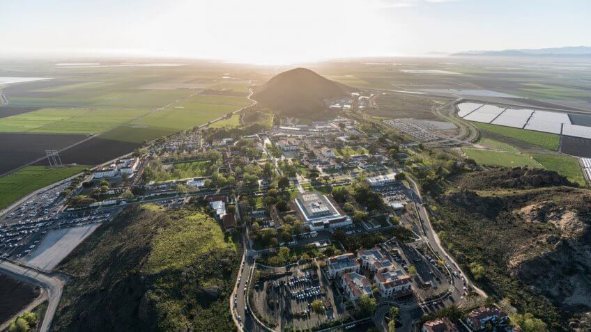 Camarillo, California, USA - March 26, 2018: Afternoon aerial view of Ventura County farm fields and California State University Channel Islands campus.