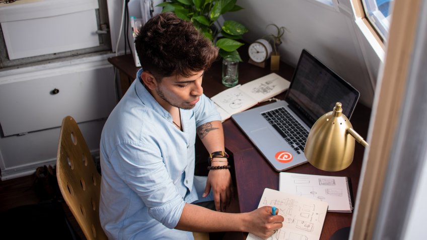 freelancer working at his desk at home
