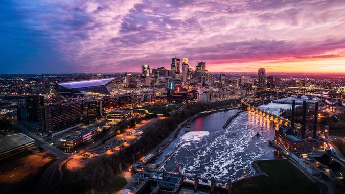 Springtime Sunset over Downtown Minneapolis, St Anthony Falls and Mississippi River - Aerial Shot.