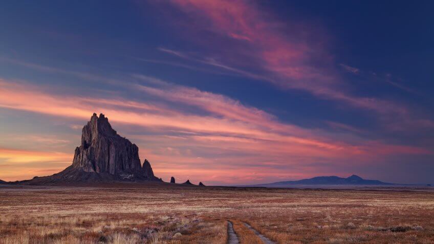 Shiprock, the great volcanic rock mountain in desert plane of New Mexico, USA.